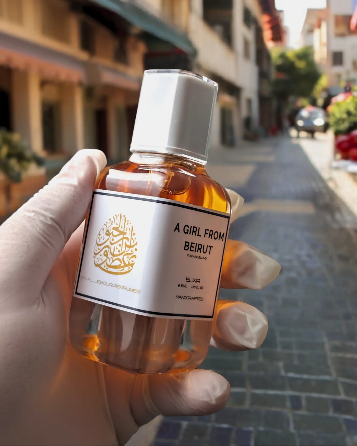 100ml amber glass parfum spray bottle of A Girl From Beirut by Ibn Al Jebouri, featuring a 40% oil concentration.