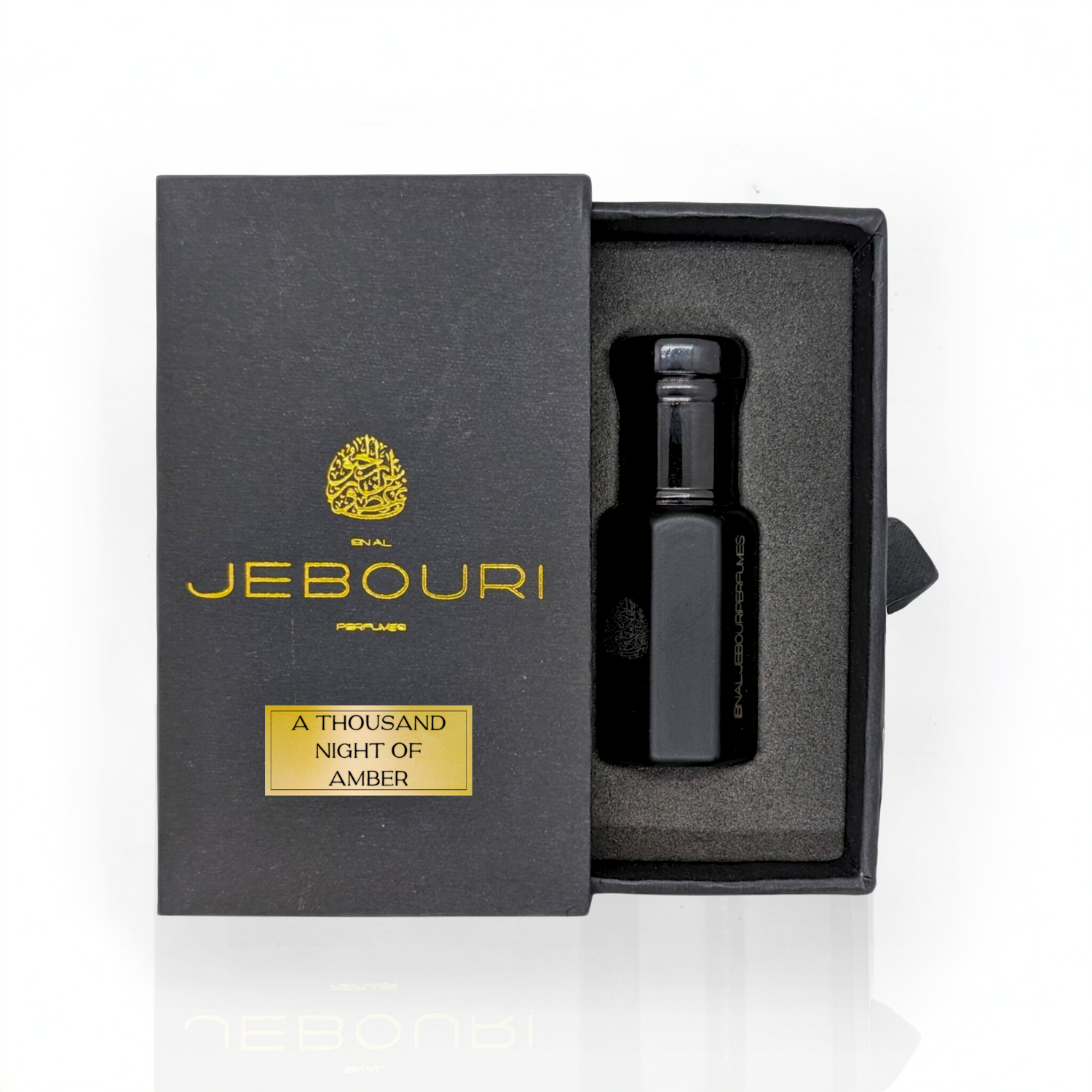 Amber perfume oil bottle labeled "A Thousand Nights" by Ibn Al Jebouri, featuring a rich amber floral scent.