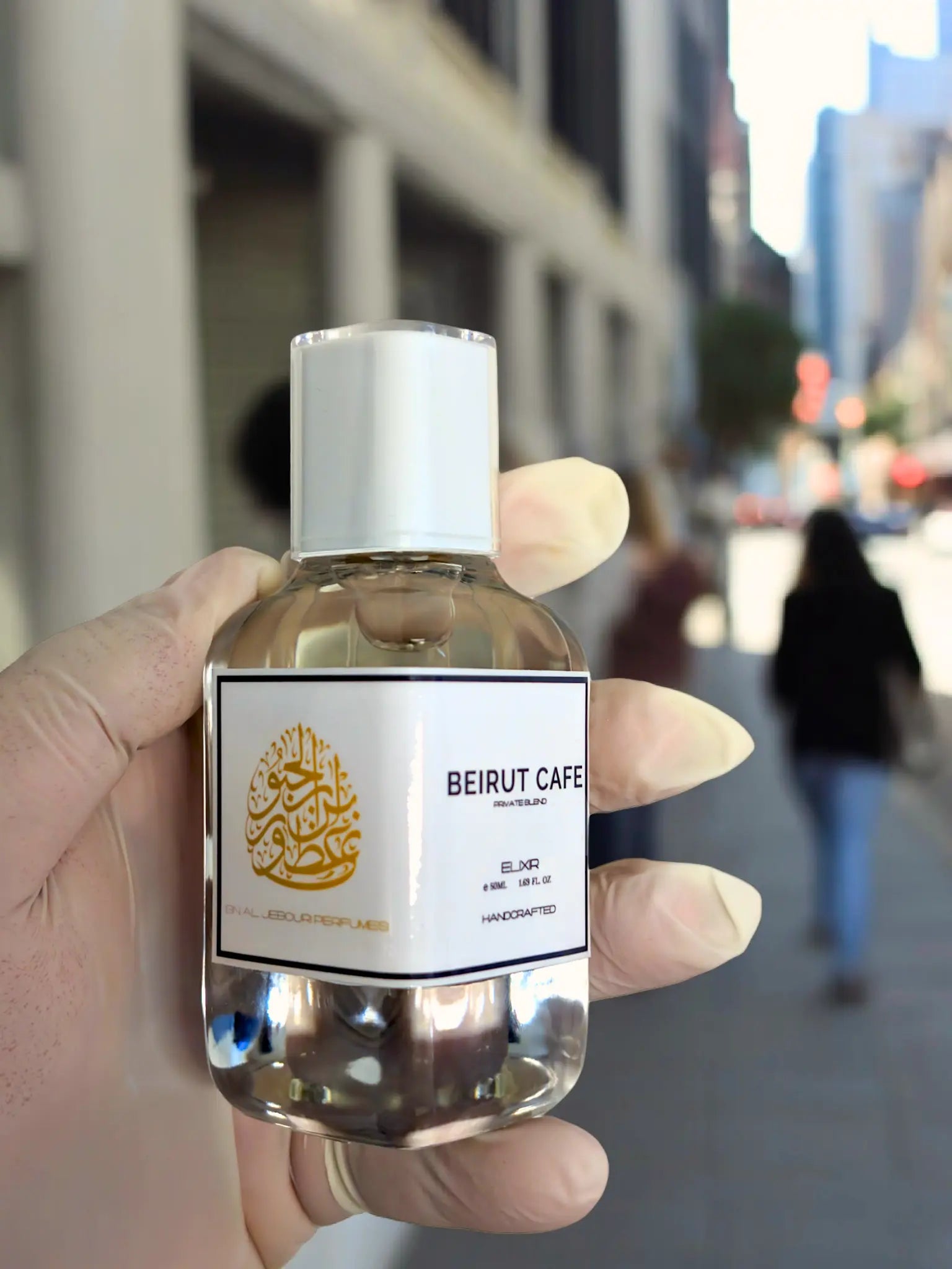 Beirut Cafe Elixir de Parfum Spray 100ml bottle showcased in an urban setting, highlighting its luxurious and handcrafted essence