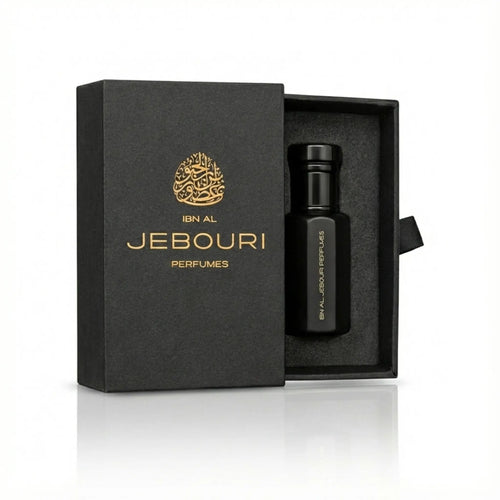 Black perfume oil bottle with gold text in a branded 'Ibn al Jebouri perfumes' box on a white background