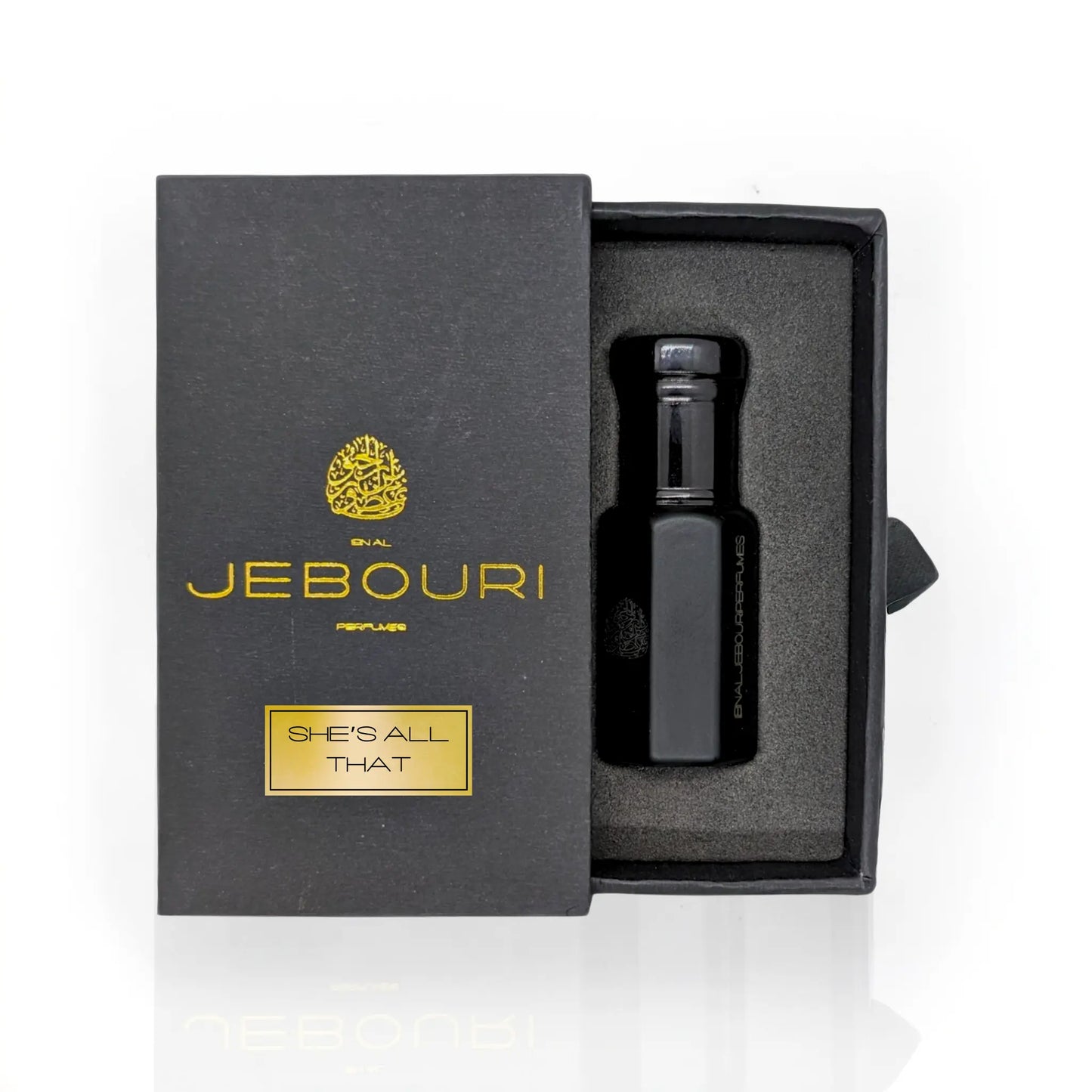 She's All That perfume oil by Ibn Al Jebouri, elegantly packaged in a sleek, matte black box with gold accents.